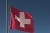 Swiss flag and mountains