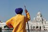 Indian in front of temple