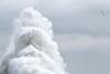 Wave crashing over sea defence