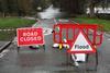 Road closed and flood sign