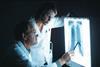 doctors looking at chest x-ray