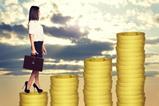 business woman standing on coins