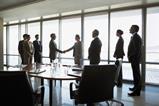 Board room shake hands