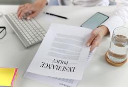 woman looking at insurance policy