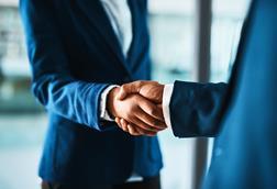 handshake men in suits