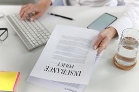 woman looking at insurance policy