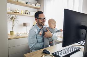 father and baby work at home