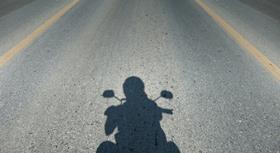 shadow motorcyclist
