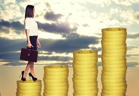 business woman standing on coins