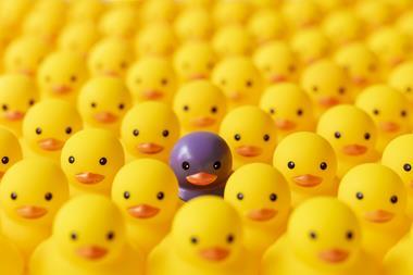 yellow ducks and one purple