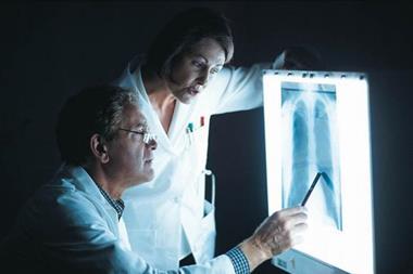 doctors looking at chest x-ray