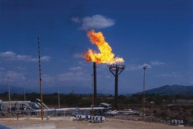 Oil refinery with burning flame