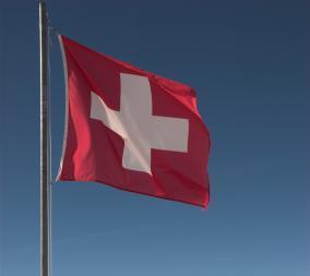 Swiss flag and mountains