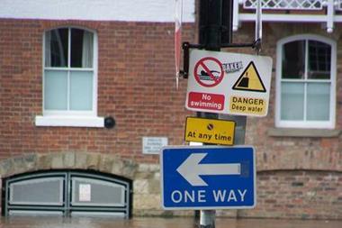 One Way sign in flooded street