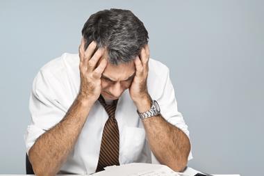 Stressed distraught worried businessman