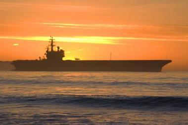 US warship against a sunset