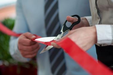 red ribbon cut man