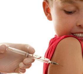 Child having an injection in the arm
