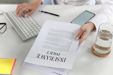 woman looking at insurance policy