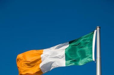 Irish flag against a blue sky