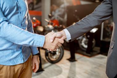 motorcycle partnership handshake
