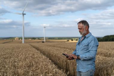 1. Farmer with Mobile phone - GettyImages