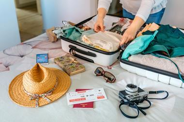 woman packing suitcase