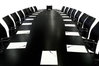 empty boardroom table and chairs