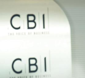 Richard Lambert of the CBI with CBI logo behind him