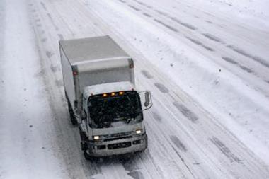 Snow-covered road with lorry