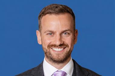 Stefan Headshot - Blue - Cropped