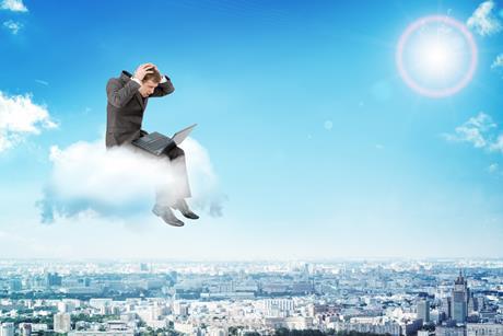 man sitting on cloud laptop