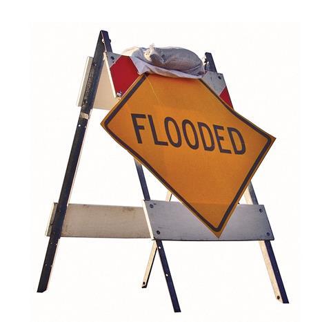 Flooded sign with sandbag