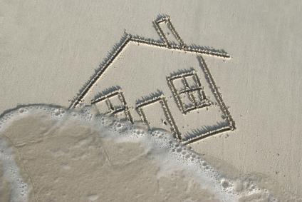 home being swept away flood sand beach