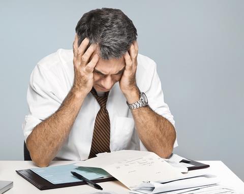 Stressed distraught worried businessman