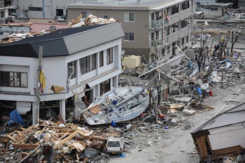 A fishing boat is among debris in Ofunato, Japan, following a 9.0 magnitude earthquake and subsequent tsunami
